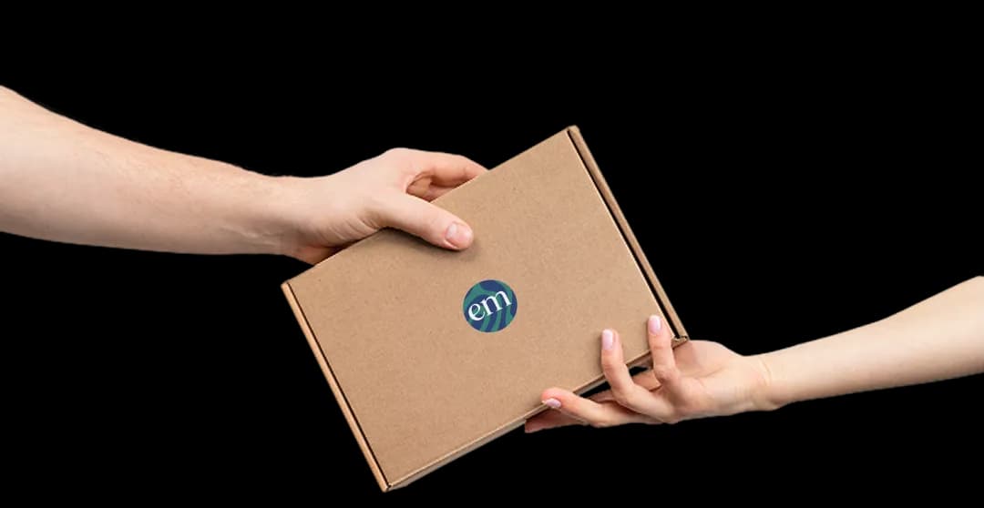 Hands passing a delivery box